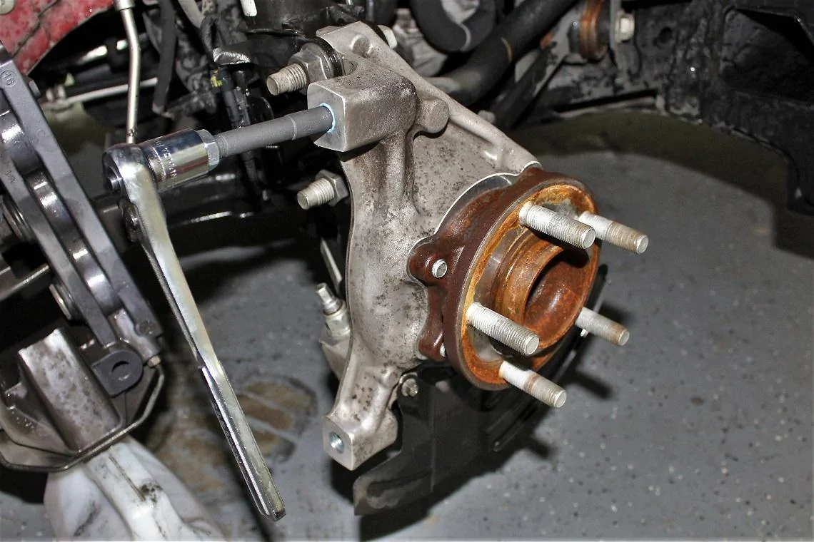 Tightening down the studs.webp