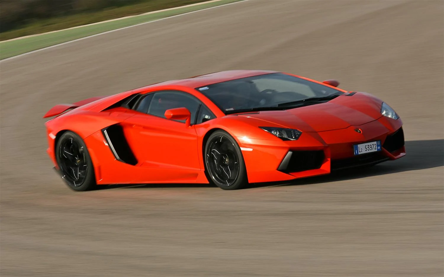 2012-Lamborghini-Aventador-LP-700-4-front-three-quarter-track.webp