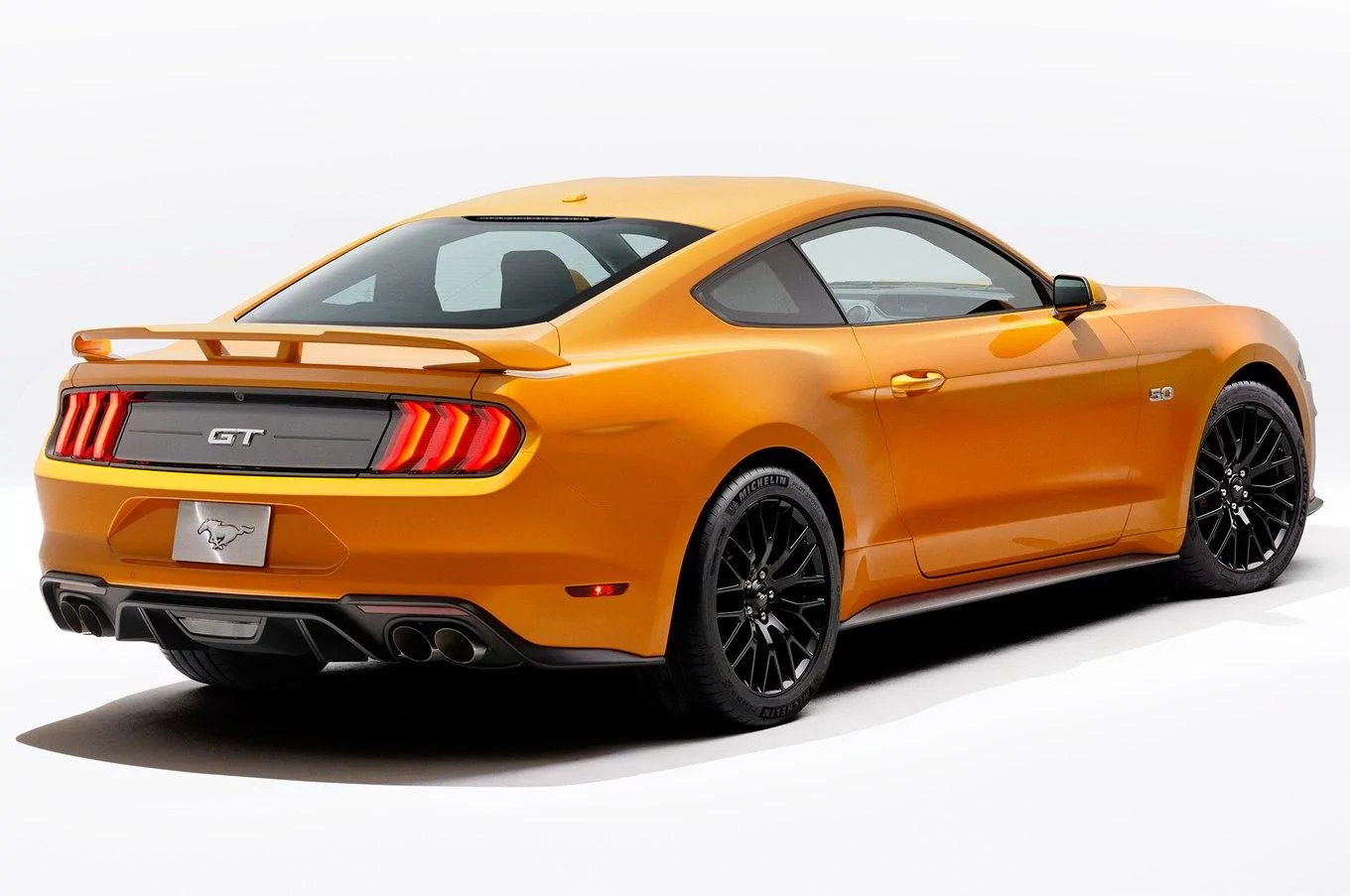2018-Ford-Mustang-V8-GT-with-Performance-Pack-rear-three-quarter-studio.webp