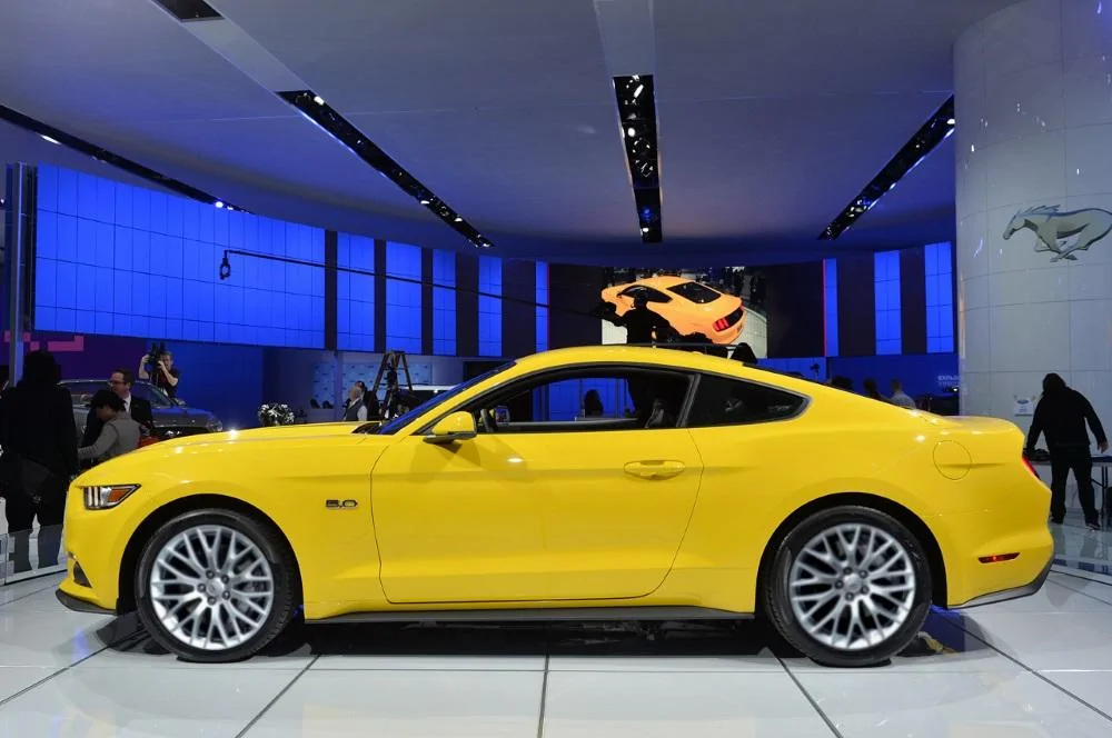 2015-Mustang-GT-Triple-Yellow-Driver-Side.webp