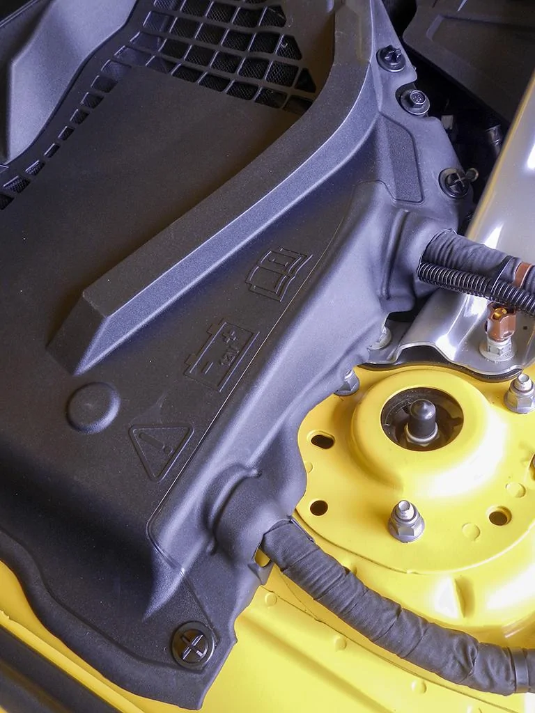 YellowCarBatteryCoverPushpinWashersWideView_DSCN5647.webp