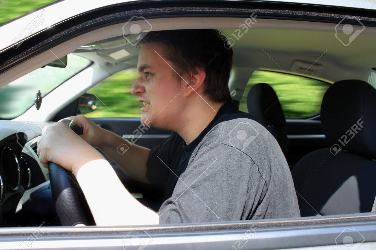 7528409-angry-young-male-driver-speeding-very-fast-showing-anger-as-roadrage.jpg