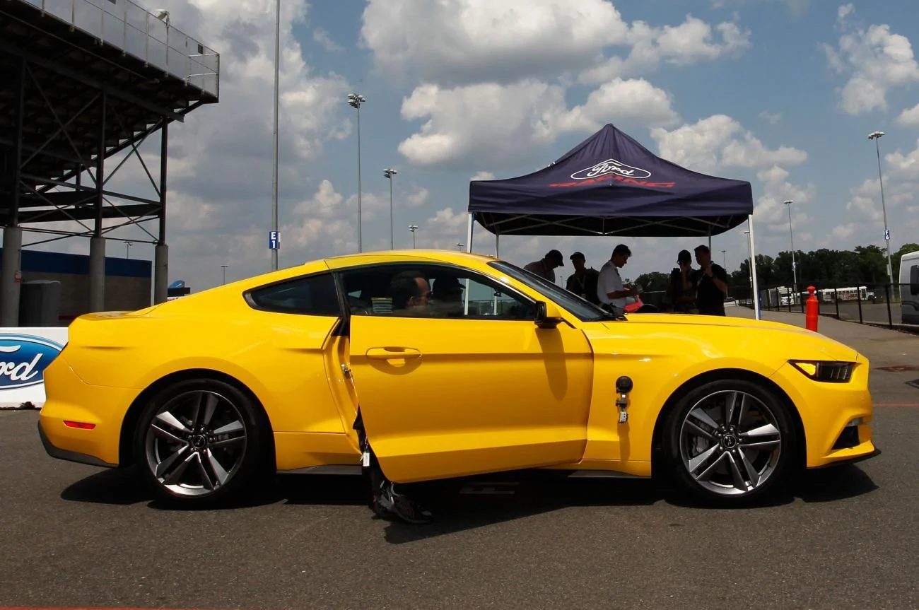 2015-Ford-Mustang-EcoBoost-side-view-door-open.webp