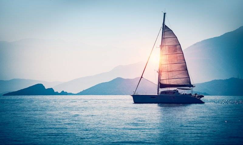 bigstock-Sailboat-in-the-sea-in-the-eve-206103793.jpg