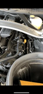 hose from car on showroom floor.webp