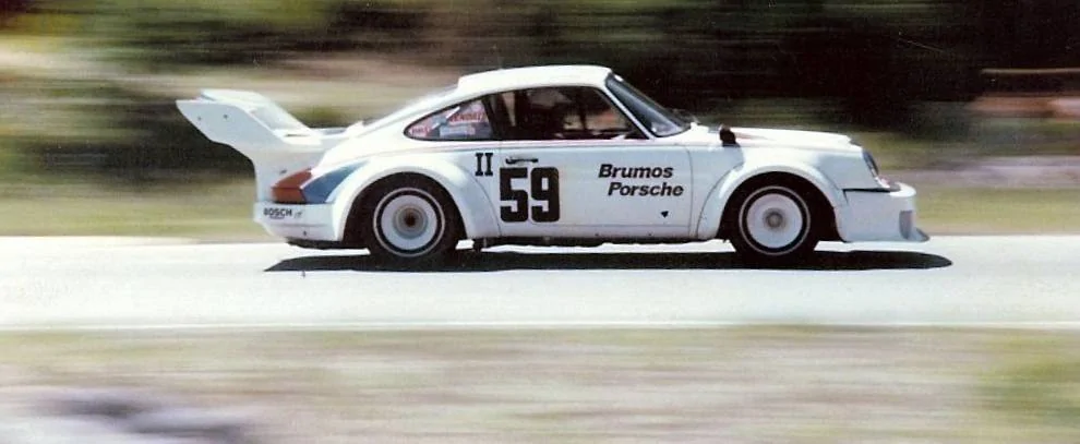 Peter Gregg in Brumos Porsche 1977 at Westwood Cropped.webp