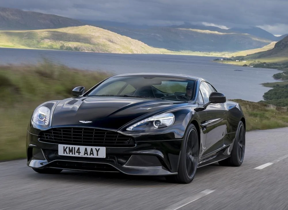 2015-aston-martin-vanquish-front-driving-black.webp