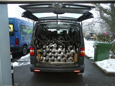 QS-van-with-loads-of-exhaus.webp