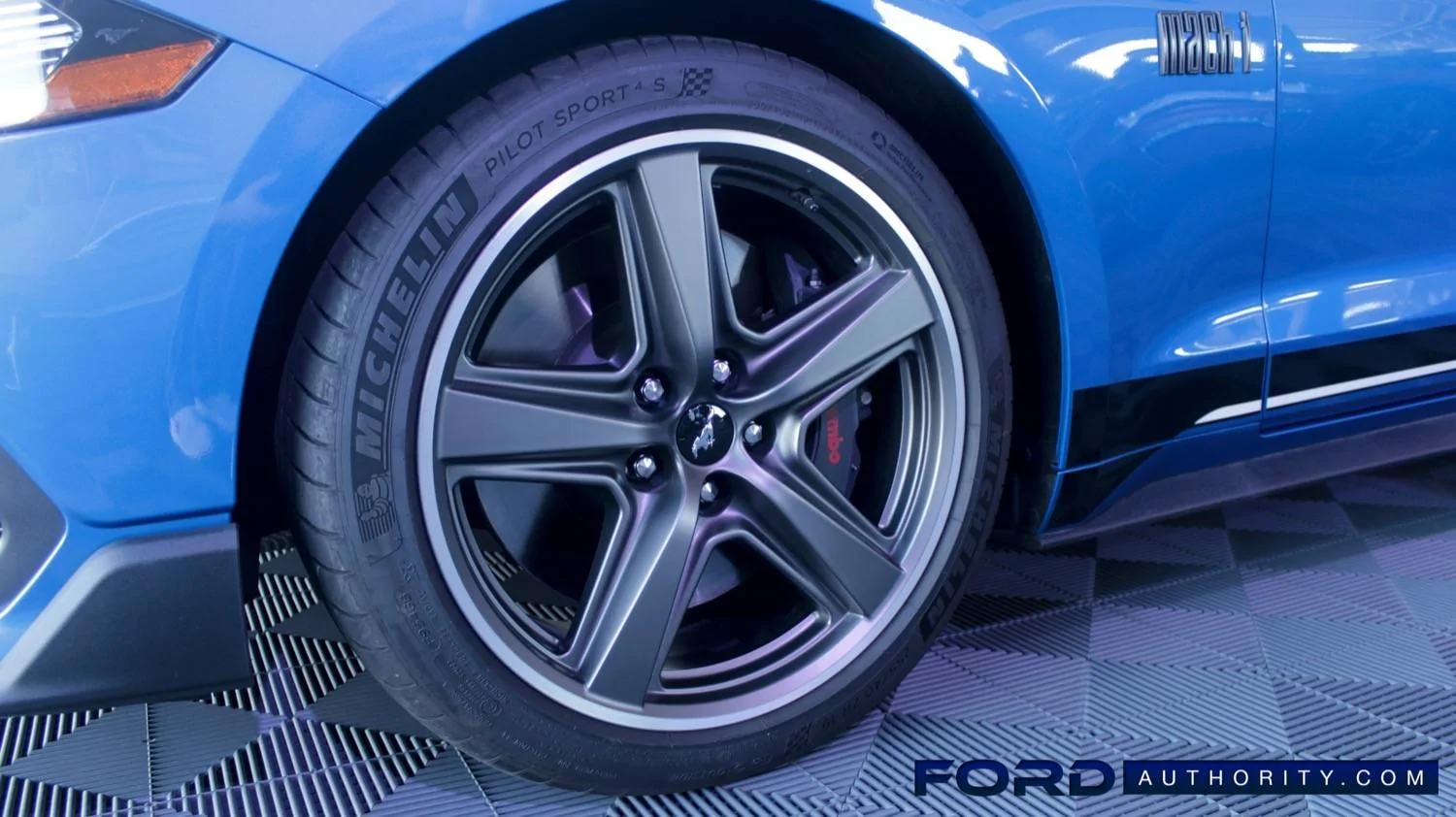 2021-Ford-Mustang-Mach-1-Exterior-Velocity-Blue-015-front-wheel-Brembo-brake-caliper.webp