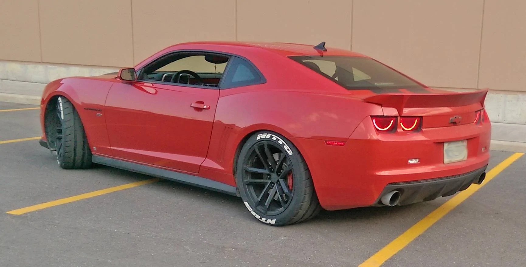 Nitto-NT05-Camaro-with-Tire-Stickers-White-Lettering.webp