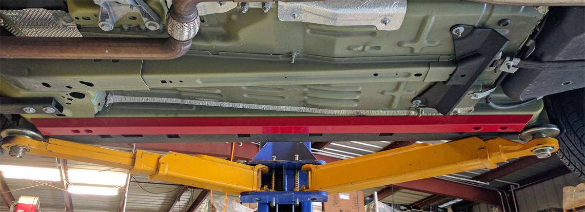 Underside-of-Mustang-With-Red-Jacking-Rails.jpg