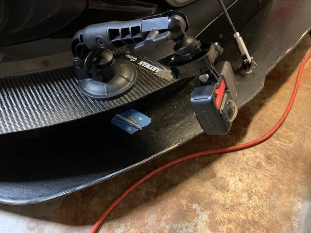 Testing the underbody airflow direction with a coat-hanger and card stock wind vane.