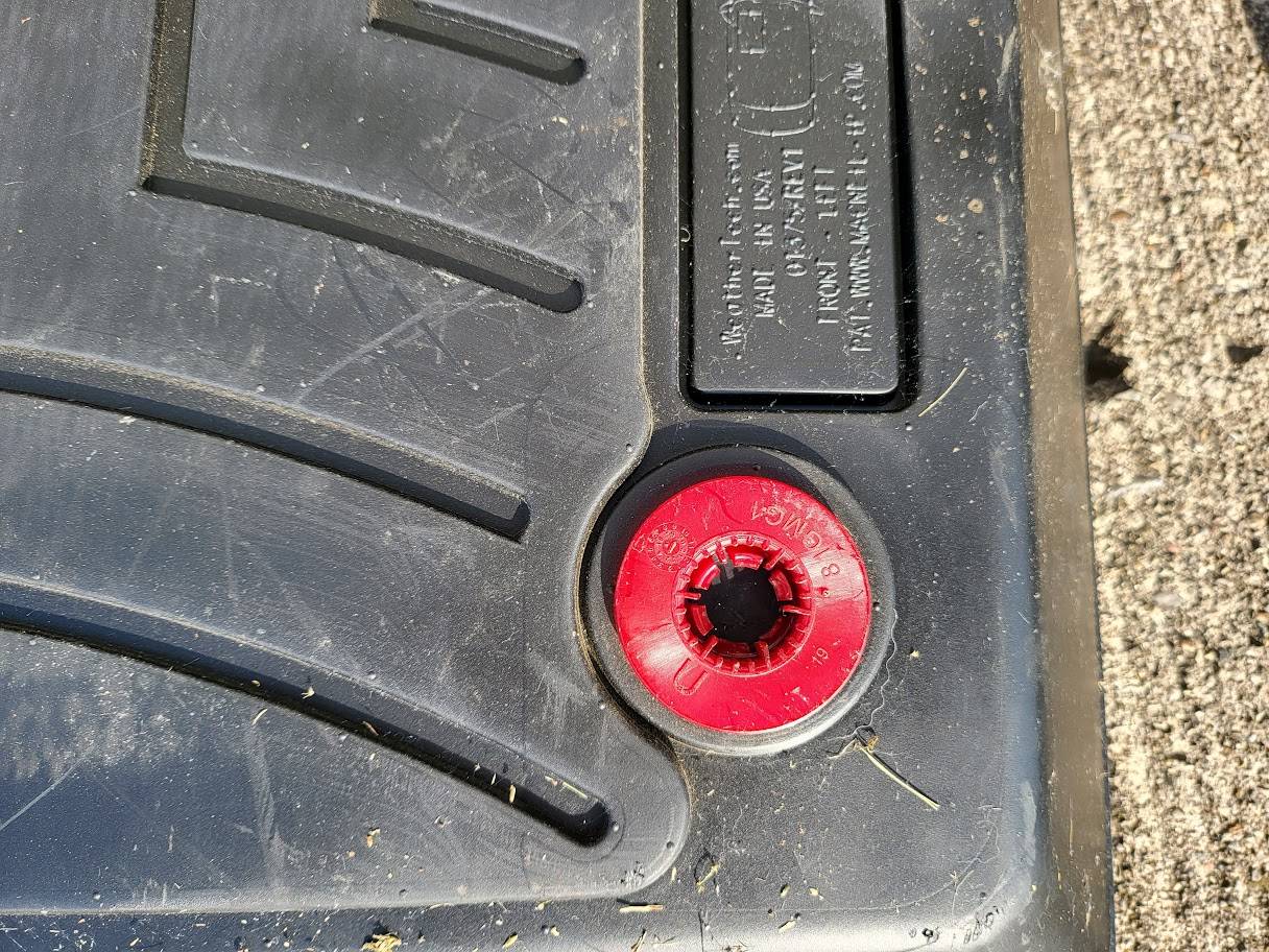 Floor mat broken tabs.jpg