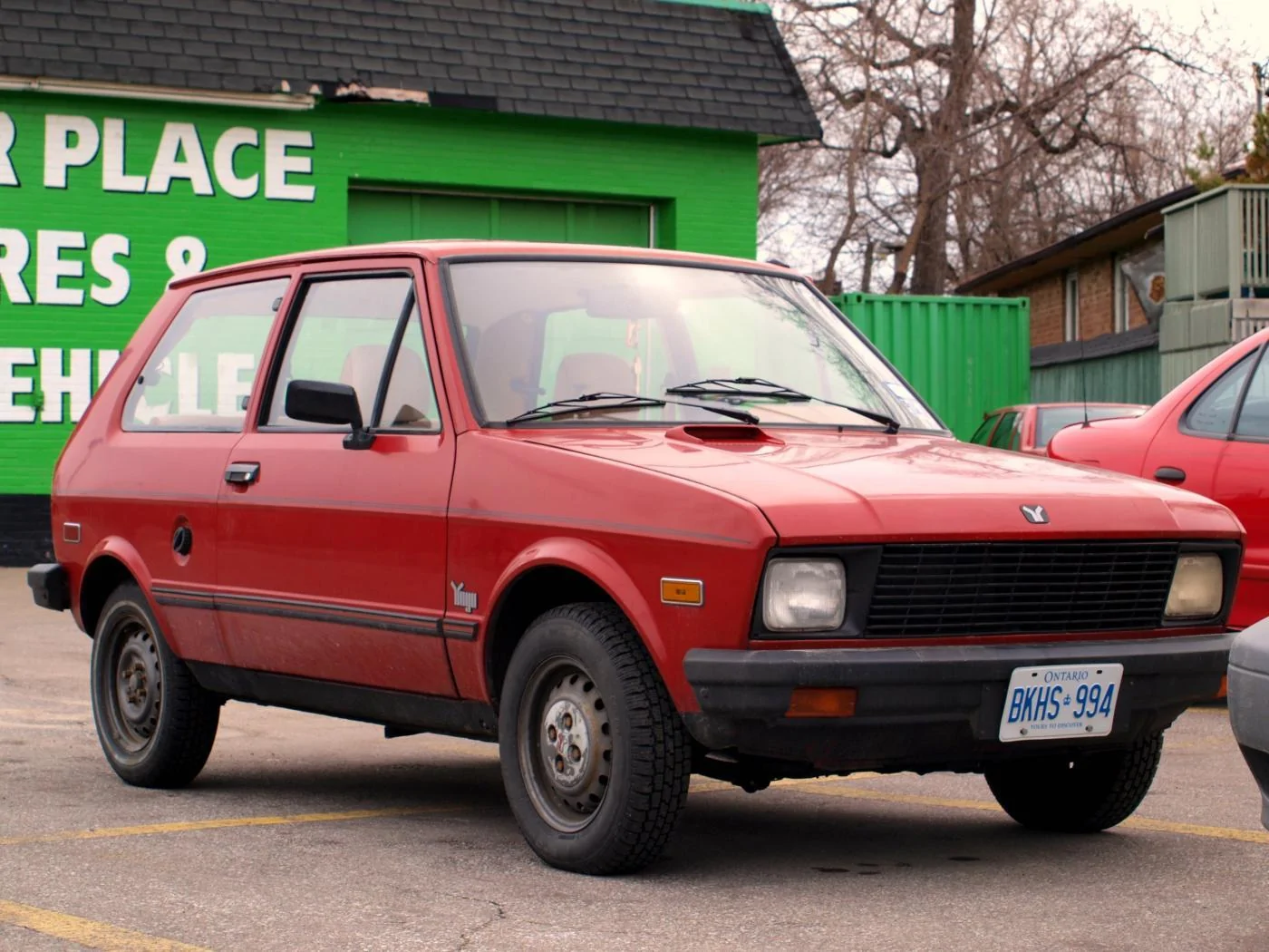 Red_Yugo_GV_in_Junction_Triangle,_Toronto,_Canada_2.webp