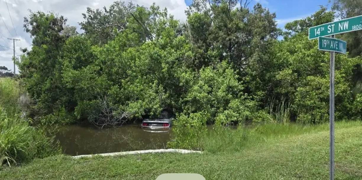 Someone's Convertible Mustang in Ditch.jpg
