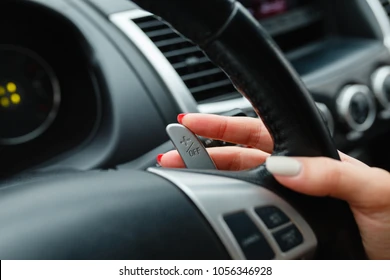 womans-hand-switches-lobes-gear-260nw-1056346928.webp