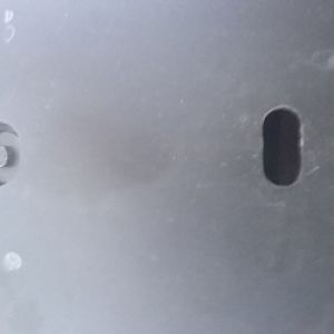 under the front of the car dead center you will find this small 7mm screw. further back there is that hole and even further there is another hole exac