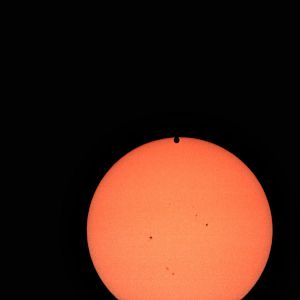 Venus crossing the face of the Sun 2012. Shot with a 4" refractor, Nikon Coolpix 995 camera and a white-light solar filter.