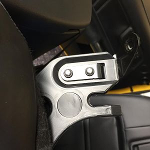 Seat back mounting tab drivers side