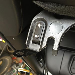 Seat back mounting tab passenger side