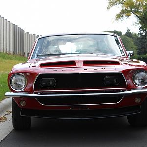 Fiberglass hood with front scoops. Those lights inside the front are foglights with the covers on them.