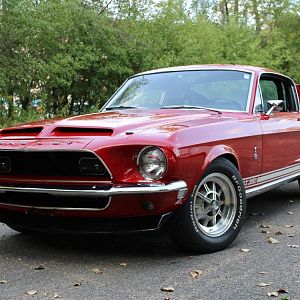 Front shot. Car is at least an inch lower than stock probably closer to 2 inches. Mid eye rear leaf springs and performance front coils with a half on