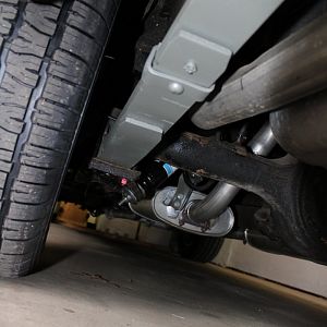 4.5 leaf springs with mid eye shackle. Bilstein rear shocks, custom made exhaust.