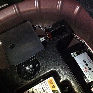 JL Audio amp + interface bolted into empty spare tire well