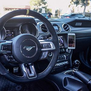 Custom GT350 steering wheel, AC pod mounted nGauge with Lund tune, Barton short shifter/transmission mount/driveshaft loop, Flossy shorty shift knob