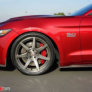 Project 6gr wheels on a Ruby Red Ford Mustang GT Front Side close up View