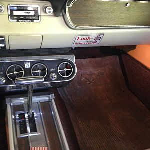 console with a/c unit and Custom Sound AM/FM/Cass radio.